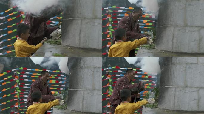 藏族父子在白塔前烧香