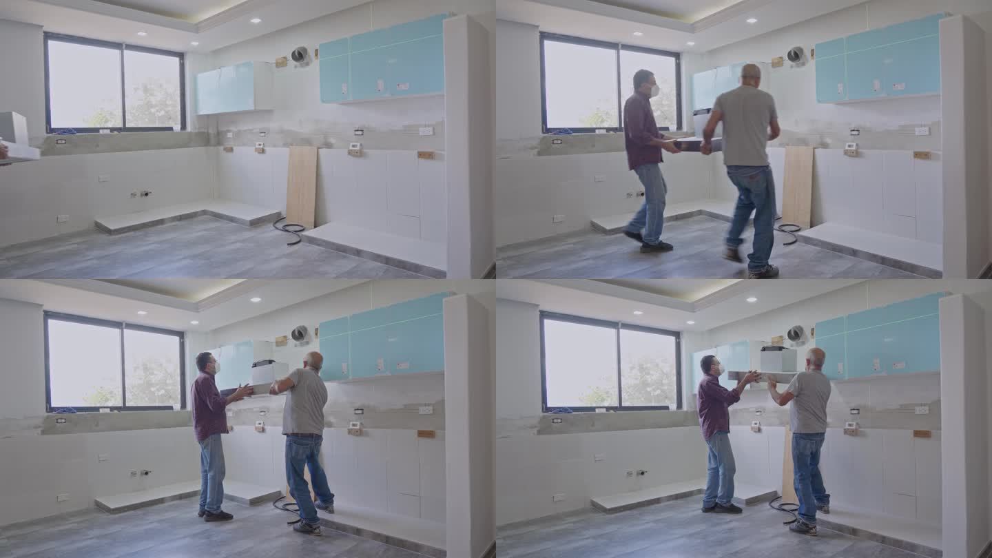 西班牙裔高级木匠在自己的房子里为厨房装修安装橱柜。