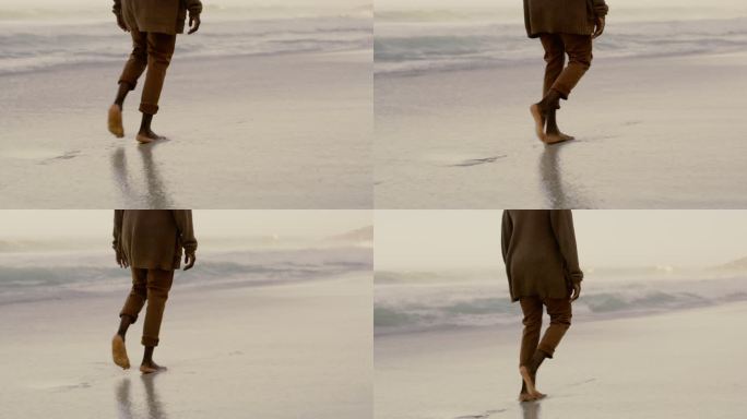 一个不知名男子沿着海滩轻松散步的4k视频片段