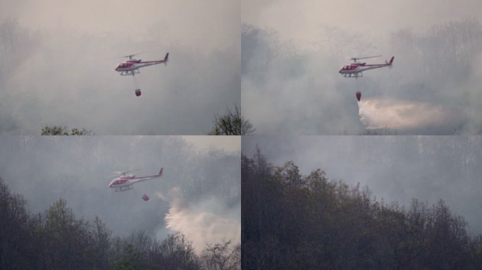 SLO MO直升机，消防队员在野火森林中喷水灭火