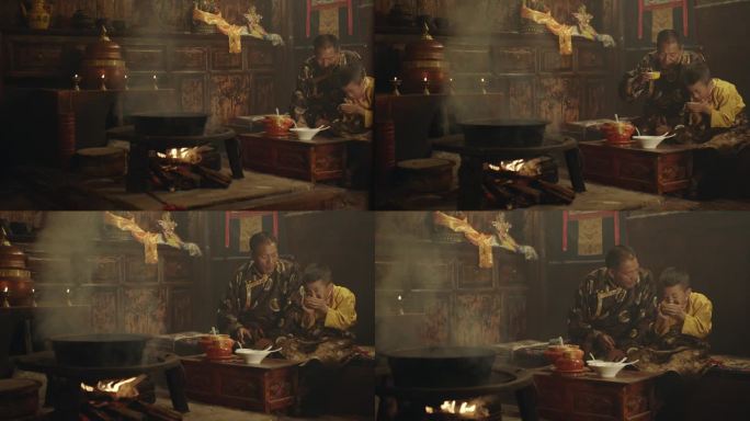 室内炉火旁藏族父子一起喝酥油茶