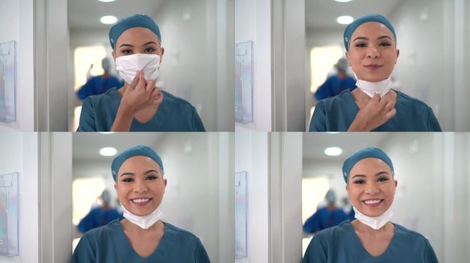一名年轻护士在医院摘下口罩微笑的肖像