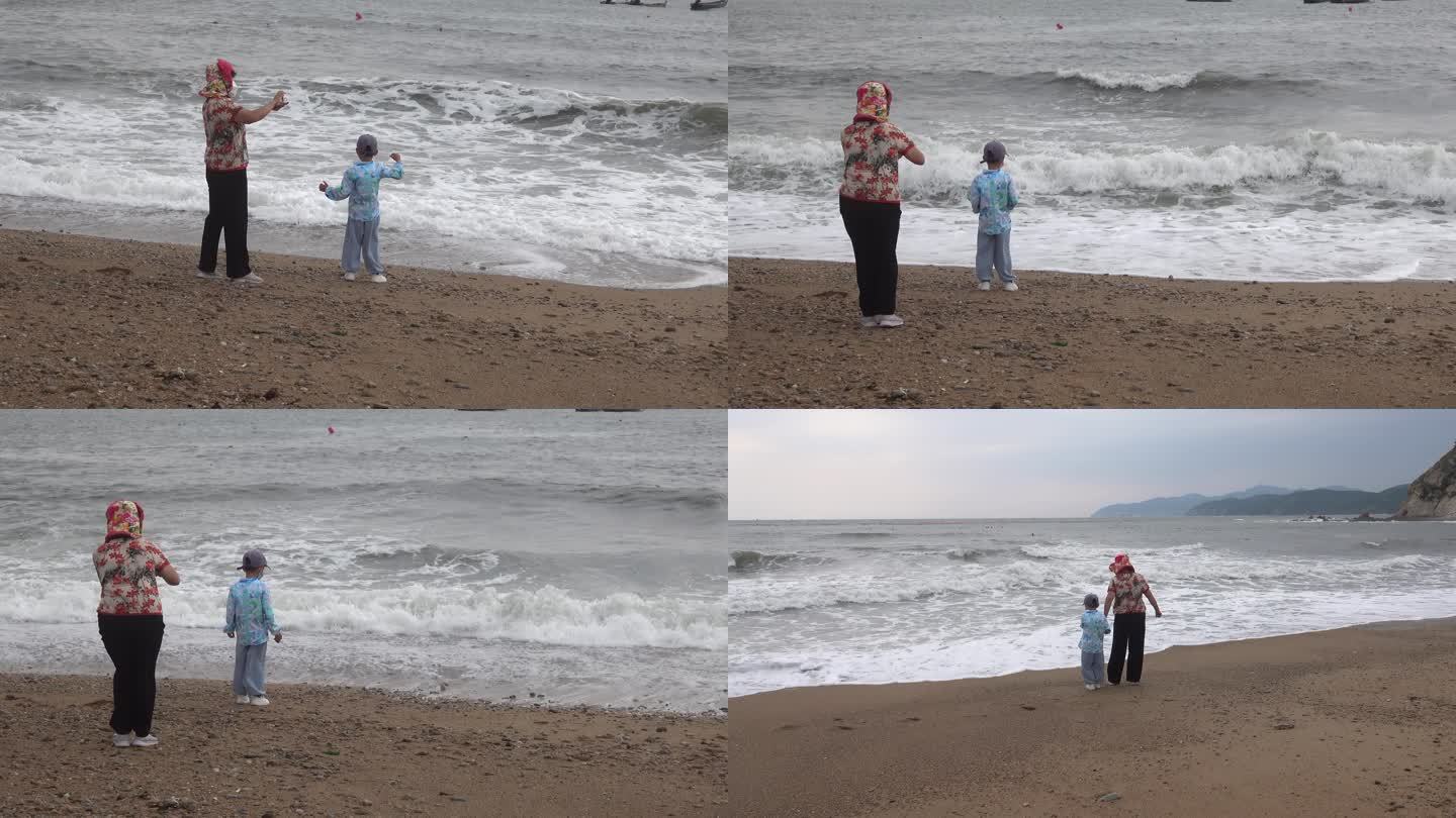 大风大浪天 带孩子海边玩耍看海