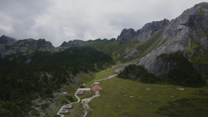 航拍山地平原五彩经幡