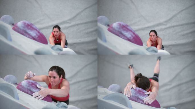 SLO MO LD女攀岩者在室内抱石健身房中悬吊