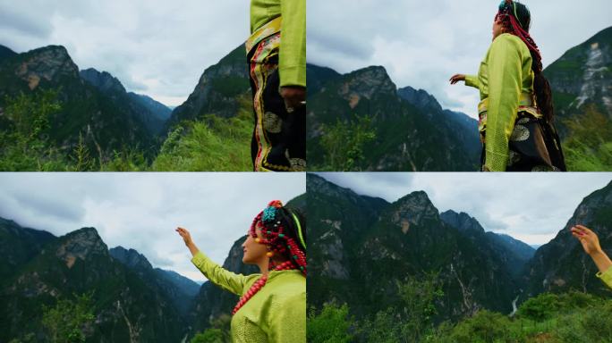 藏族女子欣赏远处的高山风景