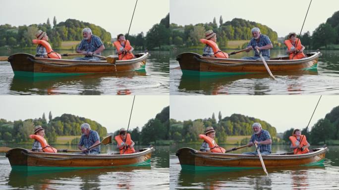 祖父和孙子坐在划船上在公园的湖边钓鱼