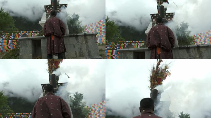 藏族男子站在白塔前