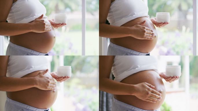 一名孕妇在腹部涂抹润肤霜的4k视频片段