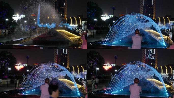 城市里夜晚的彩色喷泉
