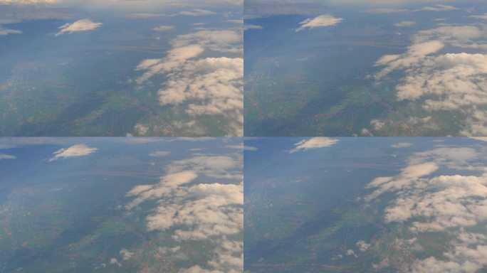 飞机窗外云和陆地