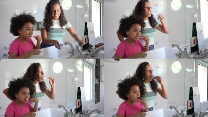 妈妈和女儿一起在家刷牙
