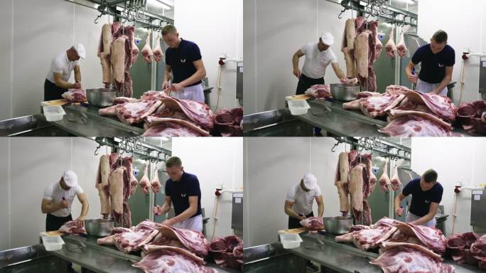 两个屠夫在切肉砍猪肉排骨卖肉