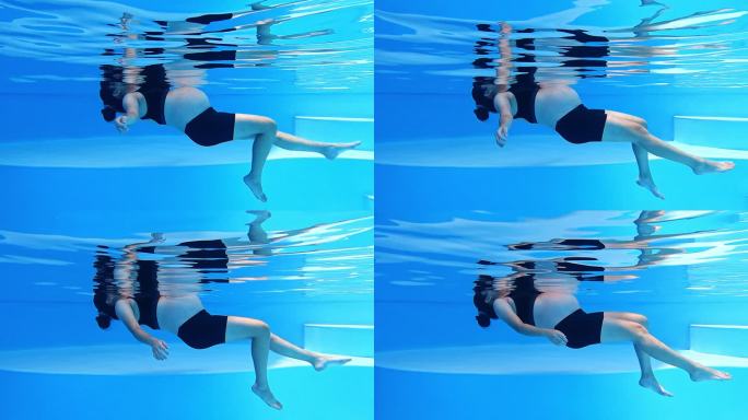 亚裔中国孕妇游泳池水下景观