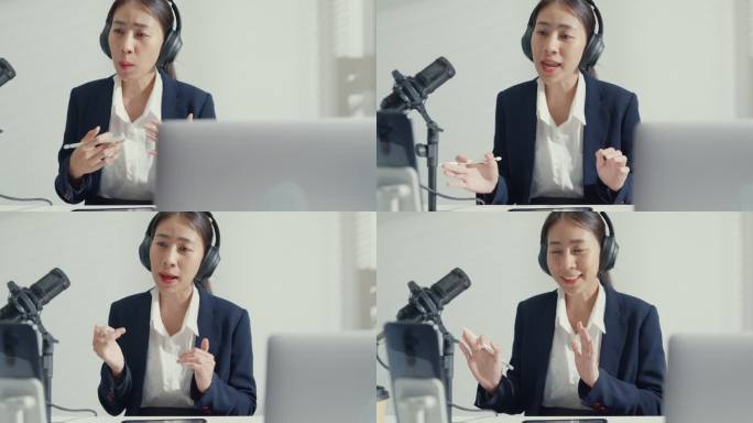 年轻的亚洲女商人用智能手机录制内容，并在工作室办公室用笔记本电脑播放播客。