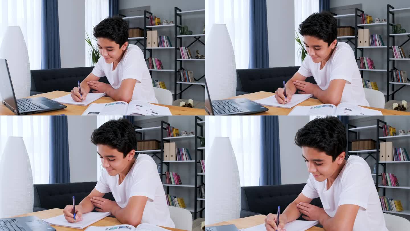 带笔记本电脑的青少年在家里上在线学校课