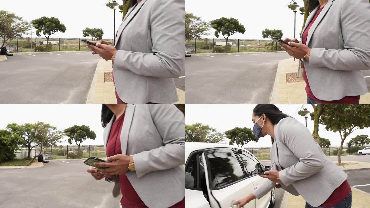 年轻女商人使用手机应用程序打出租车