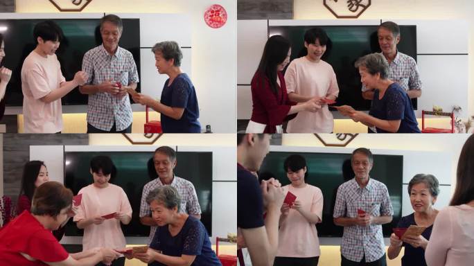 中国农历新年期间，亚裔活跃的高级妇女给家人送红包“ang pao”