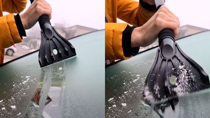 女人用刮刀刮除挡风玻璃上的冰。