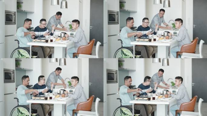 周末，坐轮椅的亚裔印度残疾人在公寓厨房为朋友们做早餐