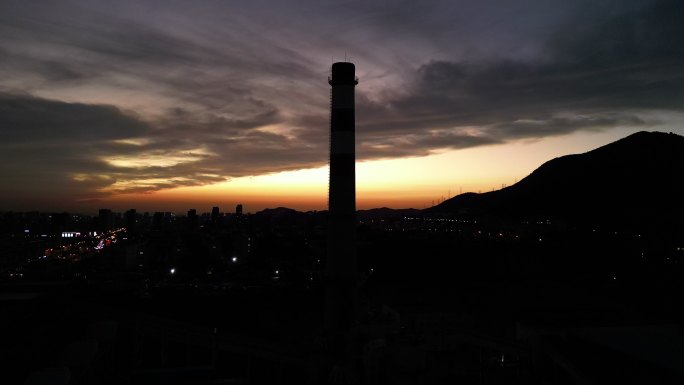 夕阳崂山城市烟囱航拍