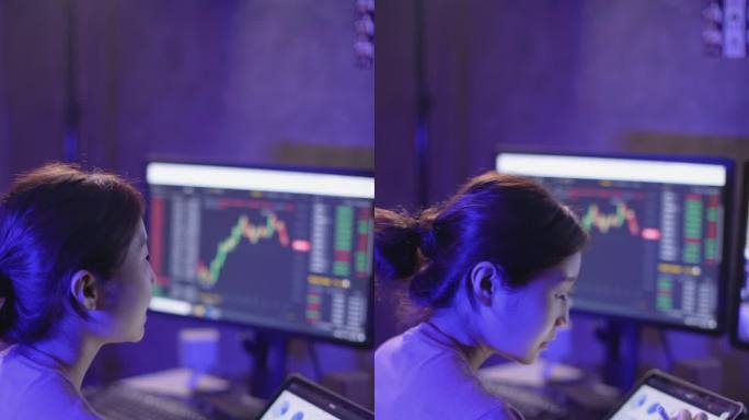 亚洲女商人深夜在公寓工作，利用电脑进行股市投资，同时通过电话会议学习