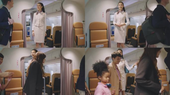 空中小姐站着欢迎旅客登机，欢迎旅客上路。