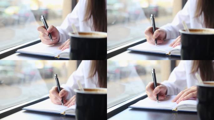 商业年轻女性写笔记特写。