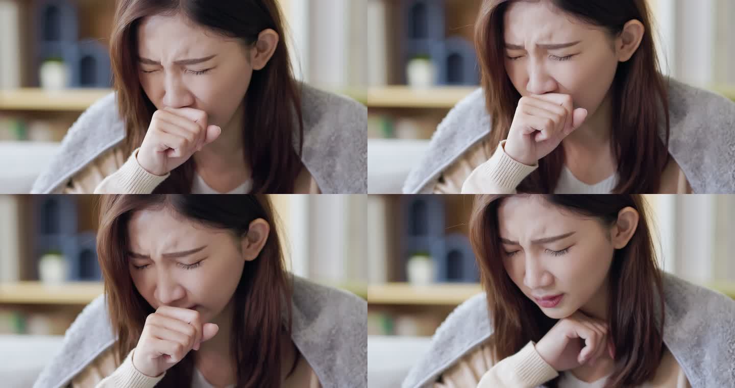 亚洲女性在家咳嗽表情痛苦生病难受扁桃体发