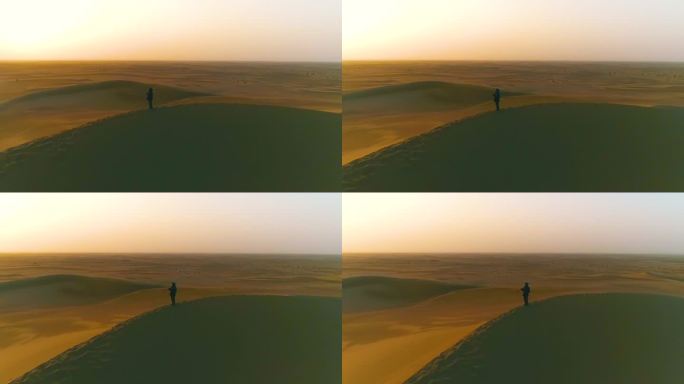 航拍大沙漠中沙丘上坚守的护沙治沙人