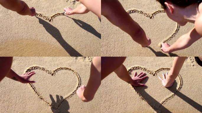 情侣在沙滩上画出一颗心