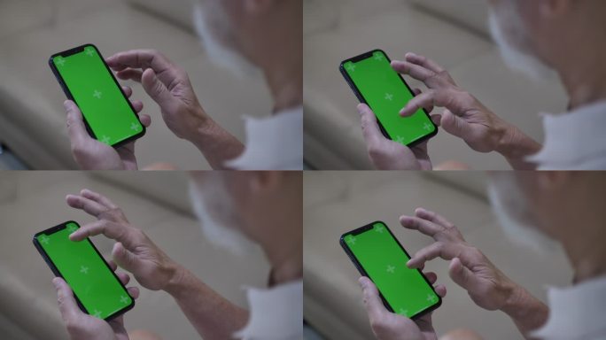 绿色模拟屏智能手机特写高级男子