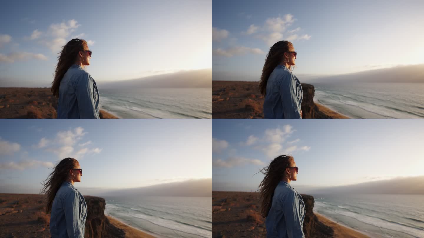一名女子从悬崖边眺望大海的特写镜头