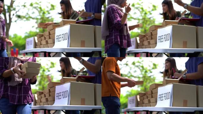 志愿者在食品库分发免费包装食品
