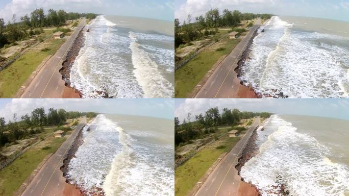 鸟瞰道路因海浪破坏沥青路面。