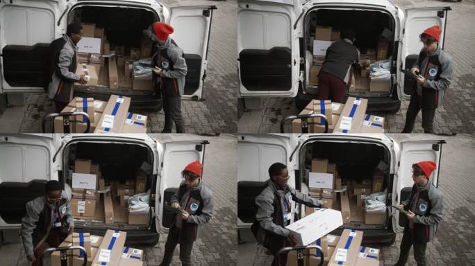 送货员与同事一起在货车上整理包裹，同时处理数字平板电脑