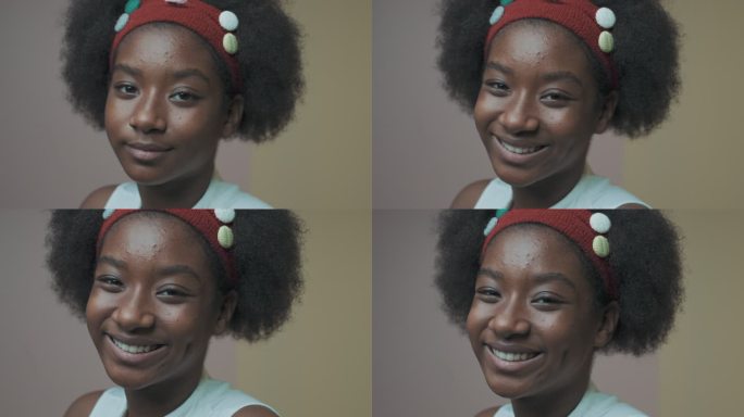个性，特写肖像非洲裔美国青少年，大头发，慢动作。