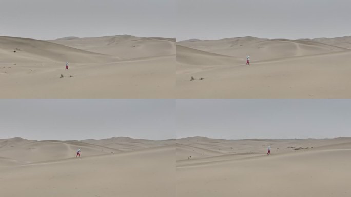 新疆塔克拉玛干沙漠中一个人在行走