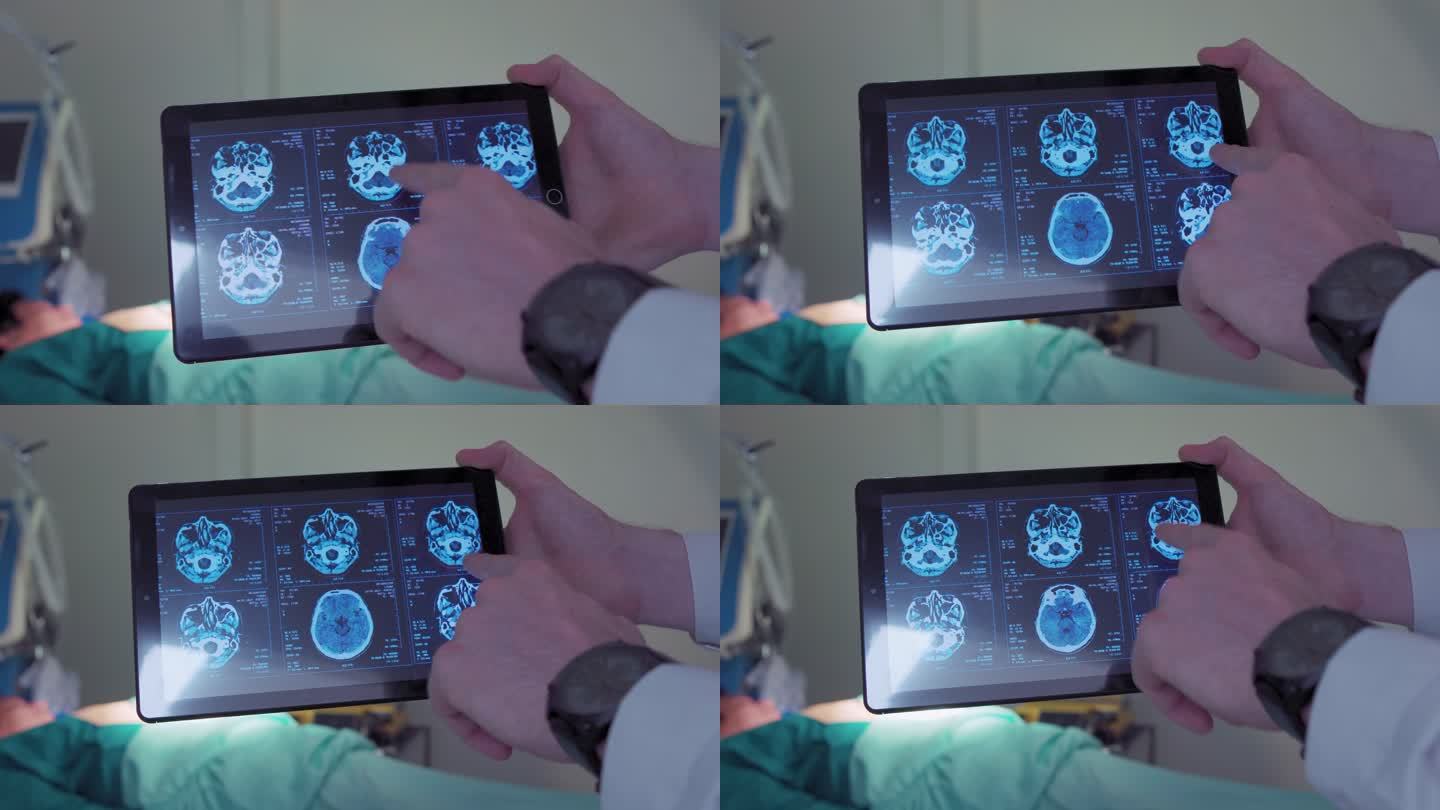 特写手部专业外科医生观看数字平板电脑上的脑部扫描显示