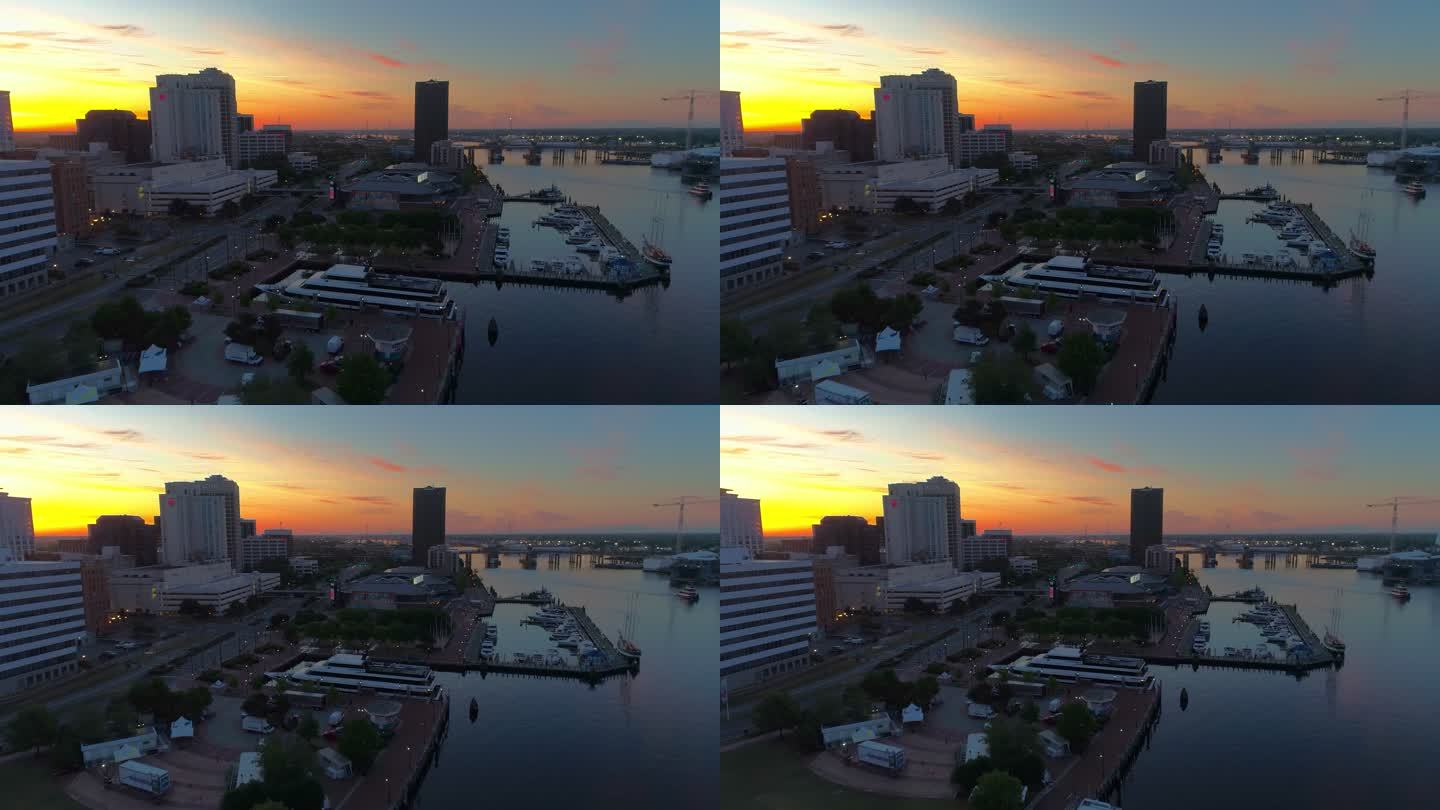 清晨暮色中，日出时分，诺福克市中心海滨和伊丽莎白河上港口的全景鸟瞰图。