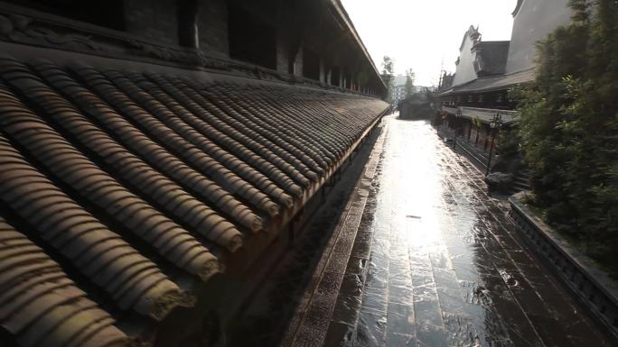 古镇 瓦房 古风 晨曦照射雨后湿滑石路