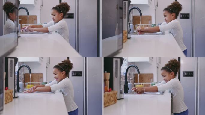 一个小女孩在家厨房水槽洗手的4k视频片段