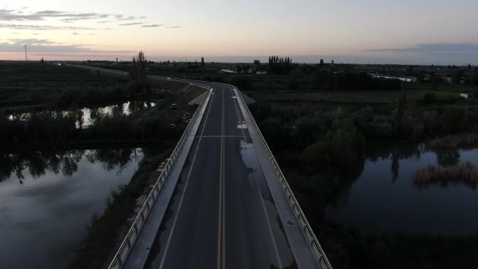 航拍酒泉果园乡湿地景观大道魏家湾大桥黄昏