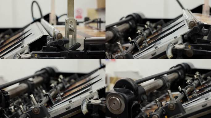 一台自动化机器的特写镜头，将印刷媒体堆放在印刷厂