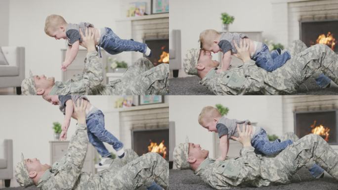 士兵父亲和他的男婴玩耍