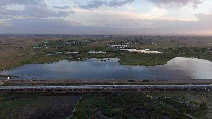 航拍酒泉市肃州区湿地景观大道锅盖梁水库
