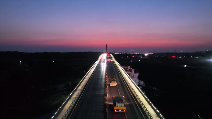 节假日夜景航拍繁忙公路车灯光流光斑