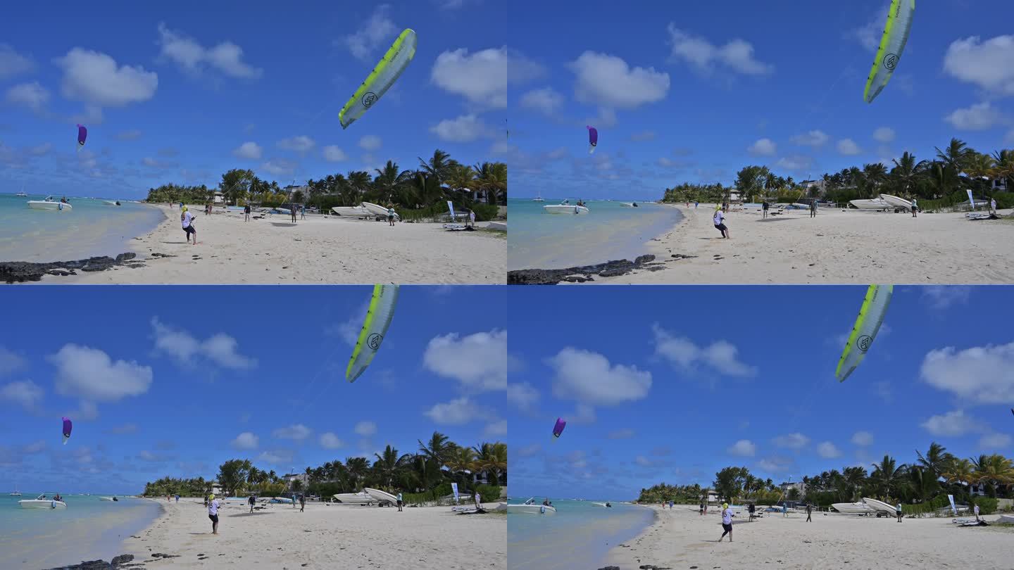 运动员在沙滩上起风筝