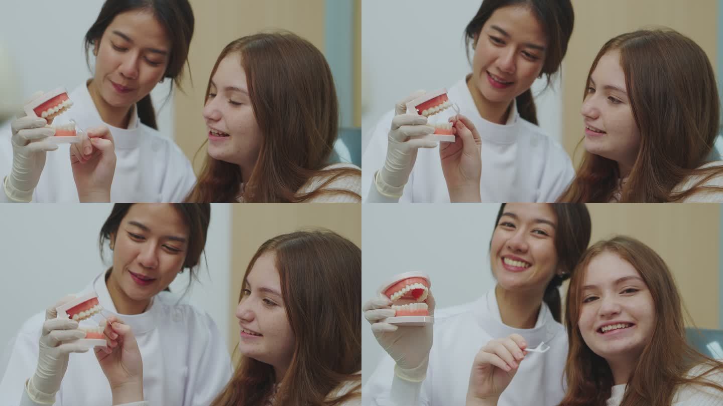 年轻的女牙医和十几岁的女孩在牙科诊所的牙医练习室拿着模型牙和牙线。