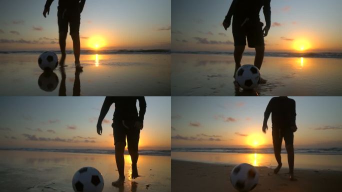 海滩上打球男孩的剪影